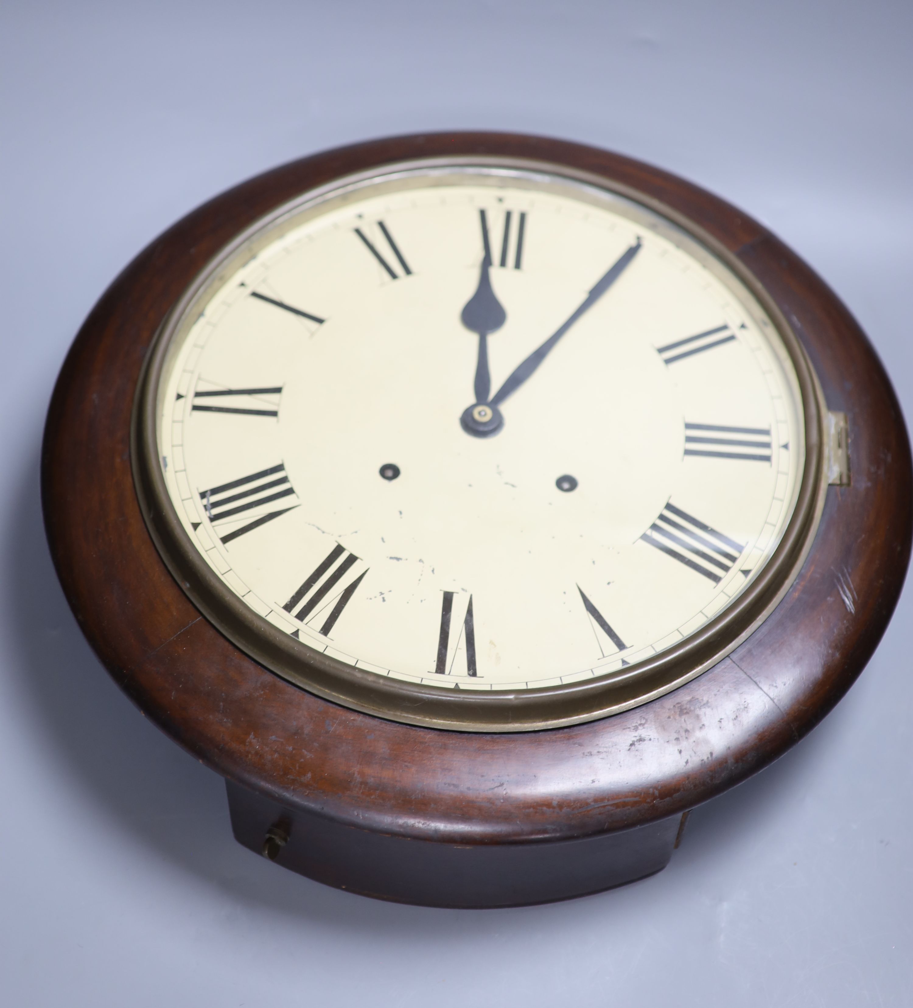 A Victorian mahogany circular wall clock